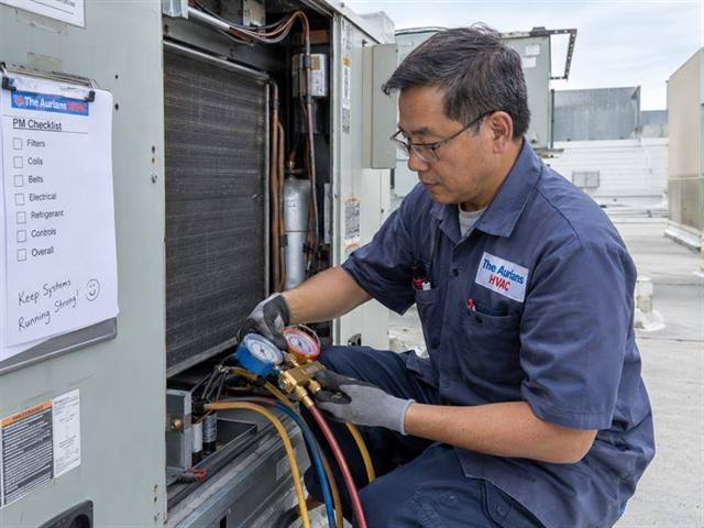Technician performing commercial HVAC maintenance